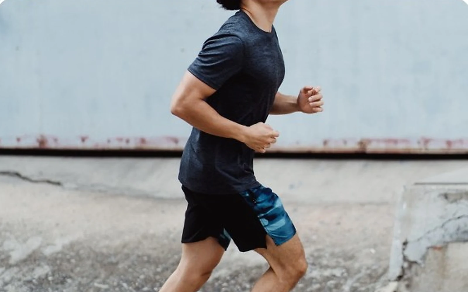 Man running outdoors, representing cardiovascular fitness and healthy aging.