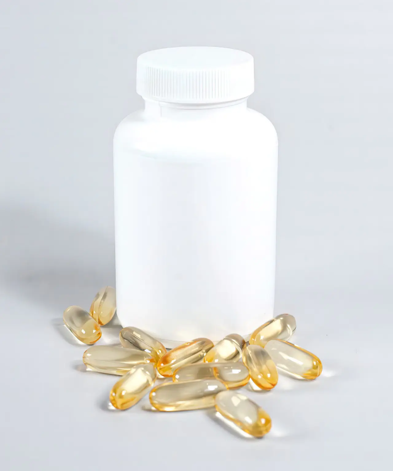 Minimal supplement bottle with capsules on a neutral background.
