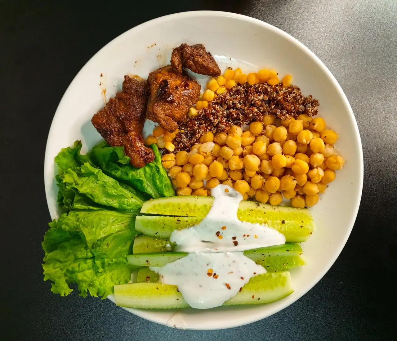 Balanced bowl with quinoa, chickpeas and fresh vegetables.