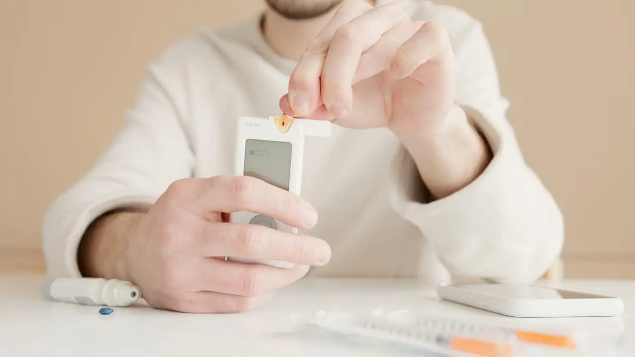 Person checking blood glucose with a handheld glucose meter.